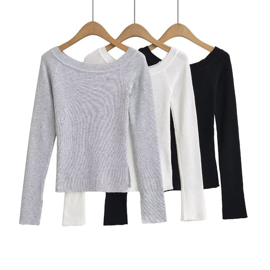 Slanted shoulder, exposed shoulder, open cuffs, top